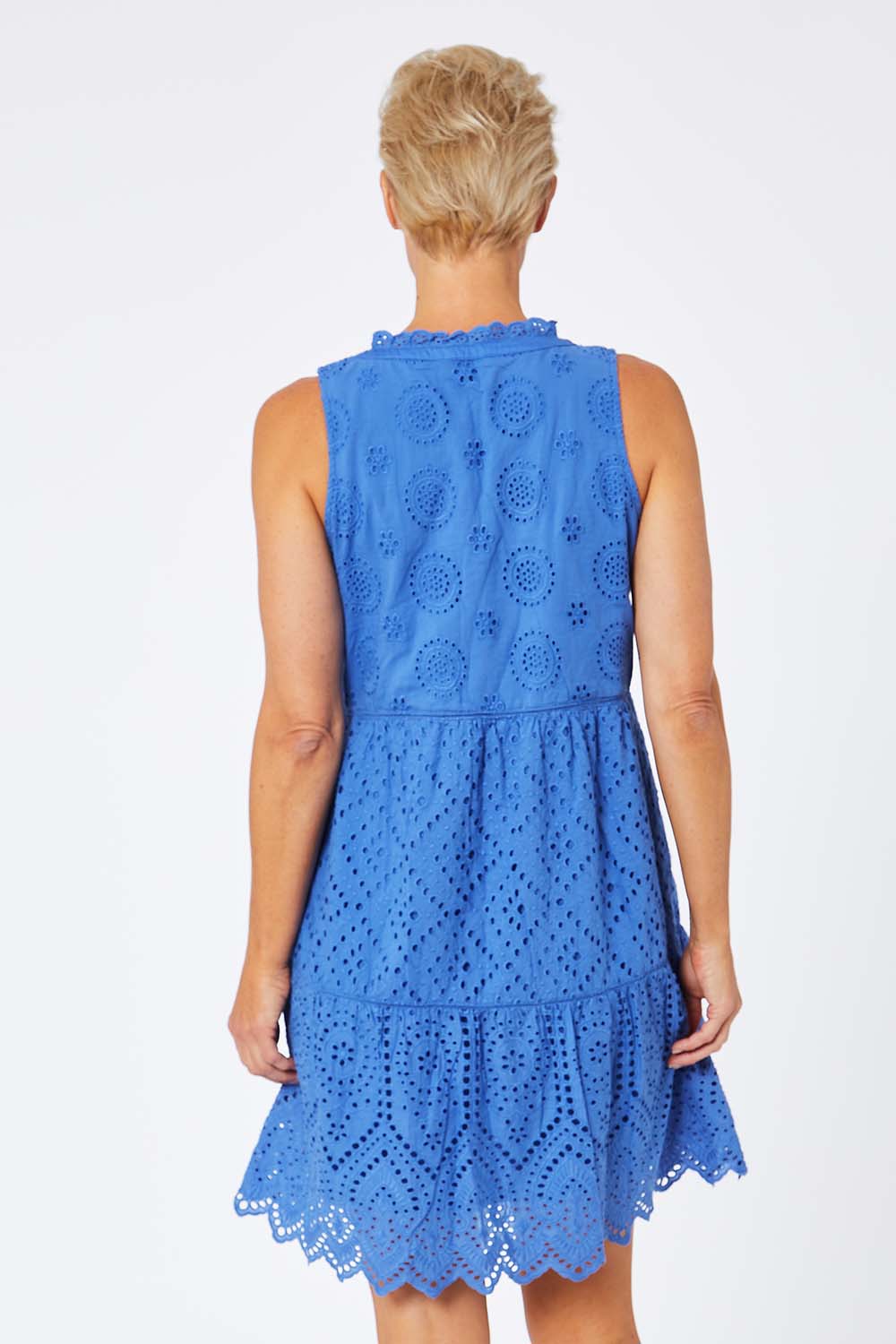 Model Amelia wearing size S of the Lauren Eyelet Dress in colour Amparoblue (Blue), from the back