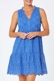 Model Amelia wearing size S of the Lauren Eyelet Dress in colour Amparoblue (Blue), from the front, cropped image