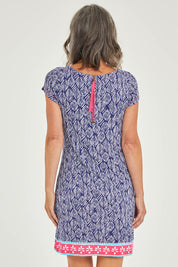 Model Luisa wearing size S of the Nellie Dress in colour Ripples (Blue), from the back