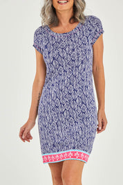 Model Luisa wearing size S of the Nellie Dress in colour Ripples (Blue), from the front, cropped image