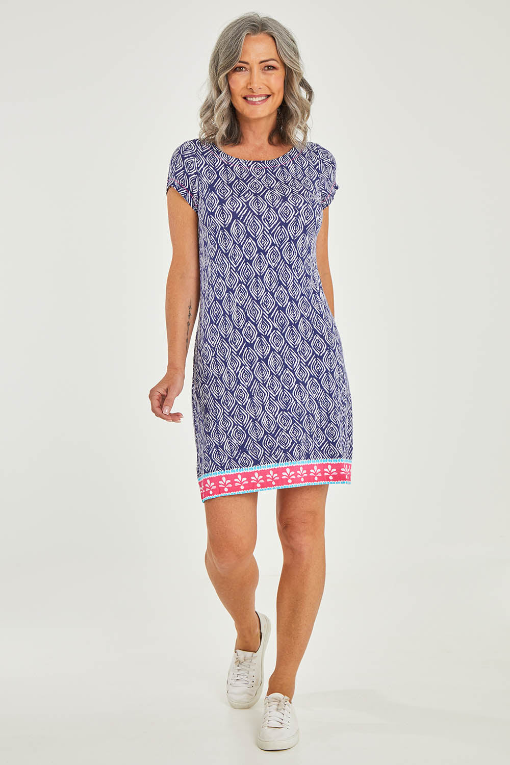 Model Luisa wearing size S of the Nellie Dress in colour Ripples (Blue), from the front, showing the whole outfit