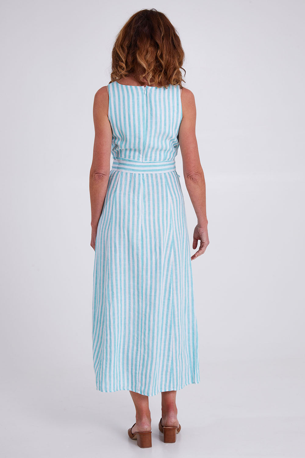 Model Emma wearing size S of the Isla Maxi Dress in colour Turquoise (Green), from the back