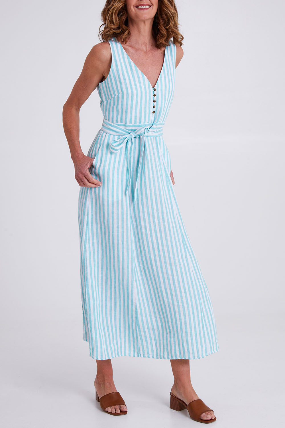 Model Emma wearing size S of the Isla Maxi Dress in colour Turquoise (Green), from the front, cropped image