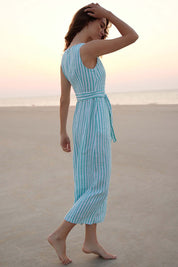 A model wearing the Isla Maxi Dress in colour Turquoise (Green), from the front, showing the whole outfit