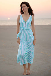 A model wearing the Isla Maxi Dress in colour Turquoise (Green), from the front, showing the whole outfit