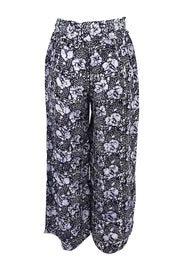 Product shot of the Cassie Pants in colour Floral (Blue), from the back