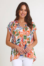 Model Madeline wearing size S of the Baja Top in colour Tide, from the front, cropped image