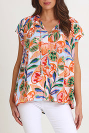 Model Madeline wearing size S of the Baja Top in colour Tide, from the front, cropped image