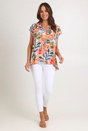 Model Madeline wearing size S of the Baja Top in colour Tide, from the front, showing the whole outfit