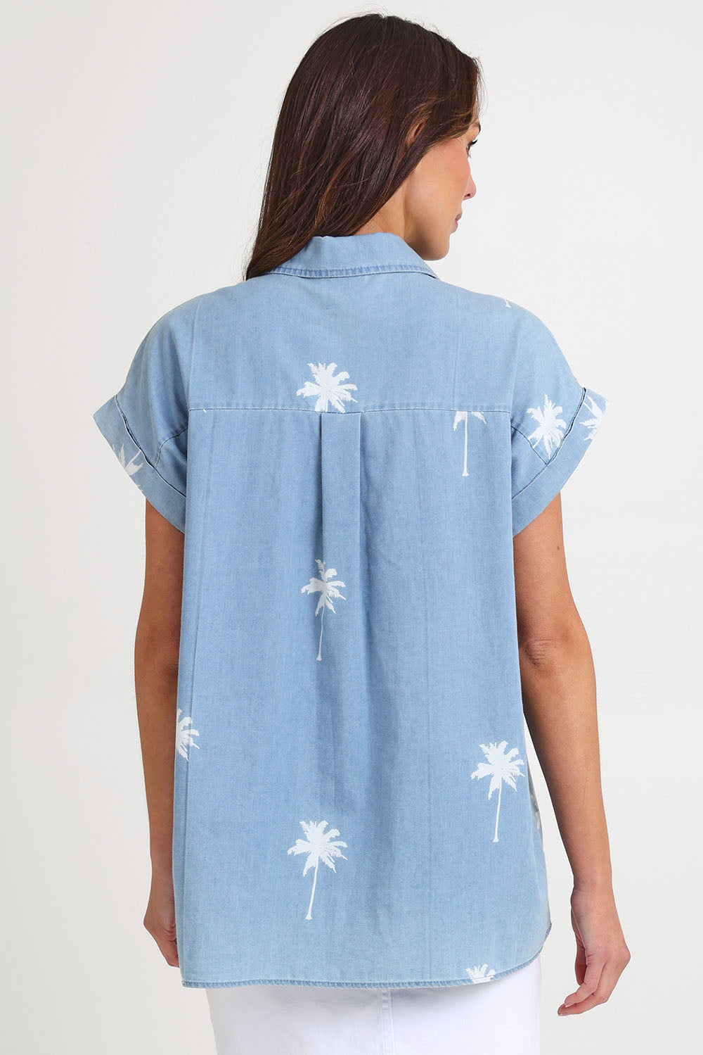 Model Monique wearing size S of the Montego Denim Shirt in colour Safira (Blue), from the back