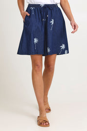 Model Madeline wearing size S of the Montego Denim Short in colour Indigo (Blue), from the front, cropped image