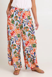 Model Madeline wearing size S of the Baja Pant in colour Tide, from the front, cropped image