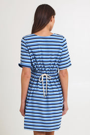 Model Madeline wearing size S of the Limon Stripe Cotton Tshirt Dress in colour Indigo (Blue), from the back