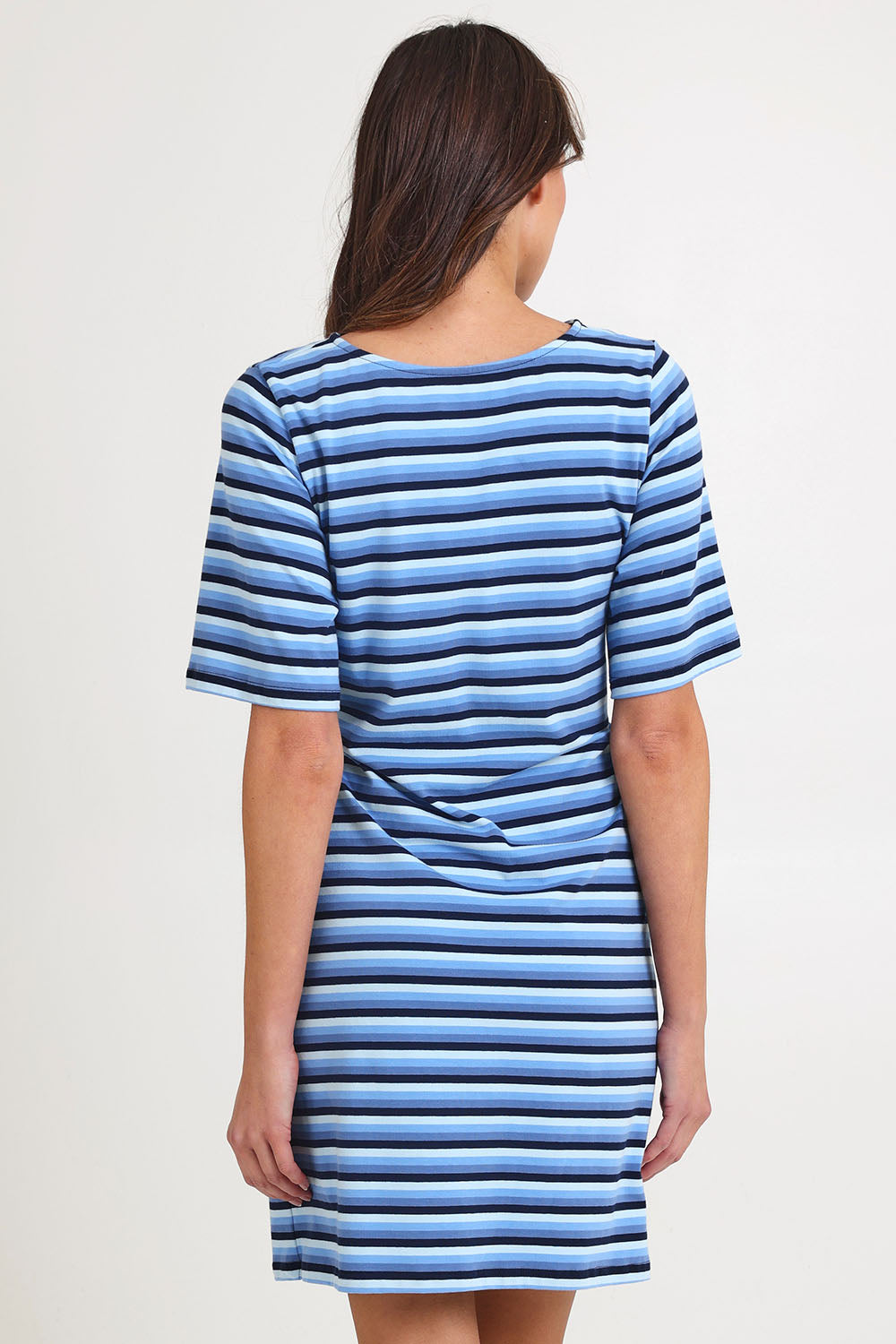 Model Madeline wearing size S of the Limon Stripe Cotton Tshirt Dress in colour Indigo (Blue), from the back