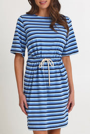 Model Madeline wearing size S of the Limon Stripe Cotton Tshirt Dress in colour Indigo (Blue), from the front, cropped image
