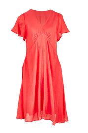 Product shot of the Baja Dress in colour Punch (Red), from the front