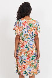 A model wearing the Baja Dress in colour Tide, from the back