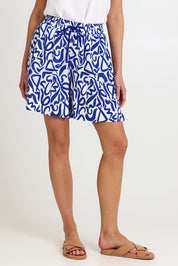 Model Madeline wearing size S of the Bahama Linen Blend Short in colour Opusazul, from the front, cropped image