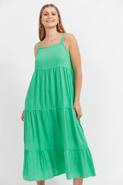 A model wearing the Haiti Tank  Maxi Dress in colour Green (Green), from the front, cropped image