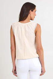 Model Madeline wearing size S of the Santos Cotton Top in colour Bisque, from the back