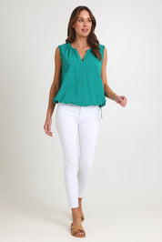 Model Madeline wearing size S of the Santos Cotton Top in colour Teal (Green), from the front, showing the whole outfit