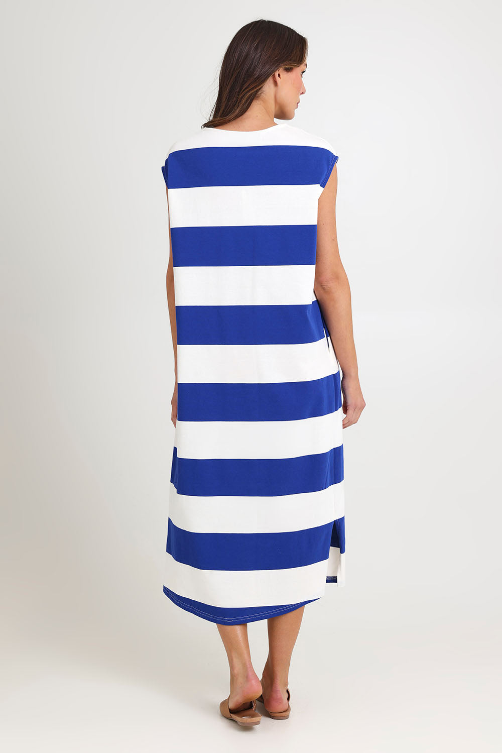 Model Madeline wearing size S of the Jardin Stripe Cotton Tshirt Dress in colour Azul (Blue), from the back