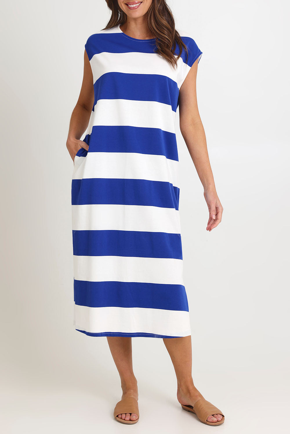 Model Madeline wearing size S of the Jardin Stripe Cotton Tshirt Dress in colour Azul (Blue), from the front, cropped image