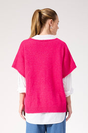 A model wearing the Valenza Knit Vest in colour Hotpink (Pink), from the back
