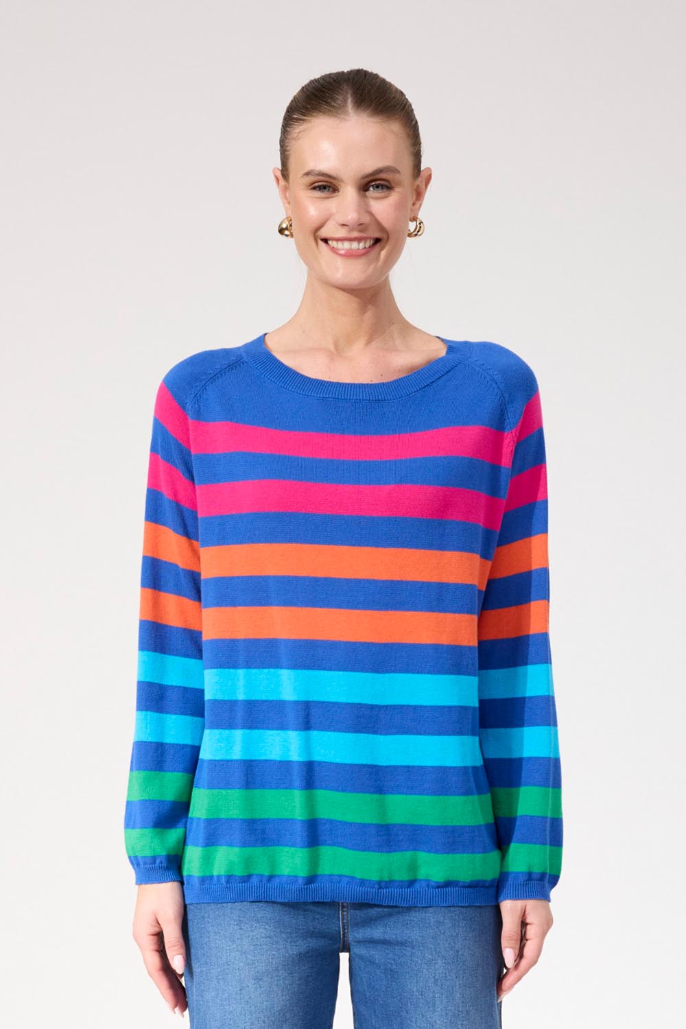 A model wearing the Vermont Stripe Jumper in colour Cobalt, from the front, cropped image