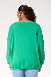 A model wearing the Vermont Star V Neck Jumper in colour Green (Green), from the back
