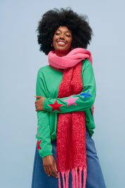 A model wearing the Vermont Star V Neck Jumper in colour Green (Green), from the front, showing the whole outfit