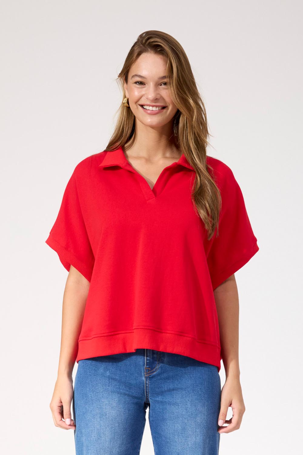 A model wearing the Boston Crop Sweat Top in colour Red (Red), from the front, cropped image