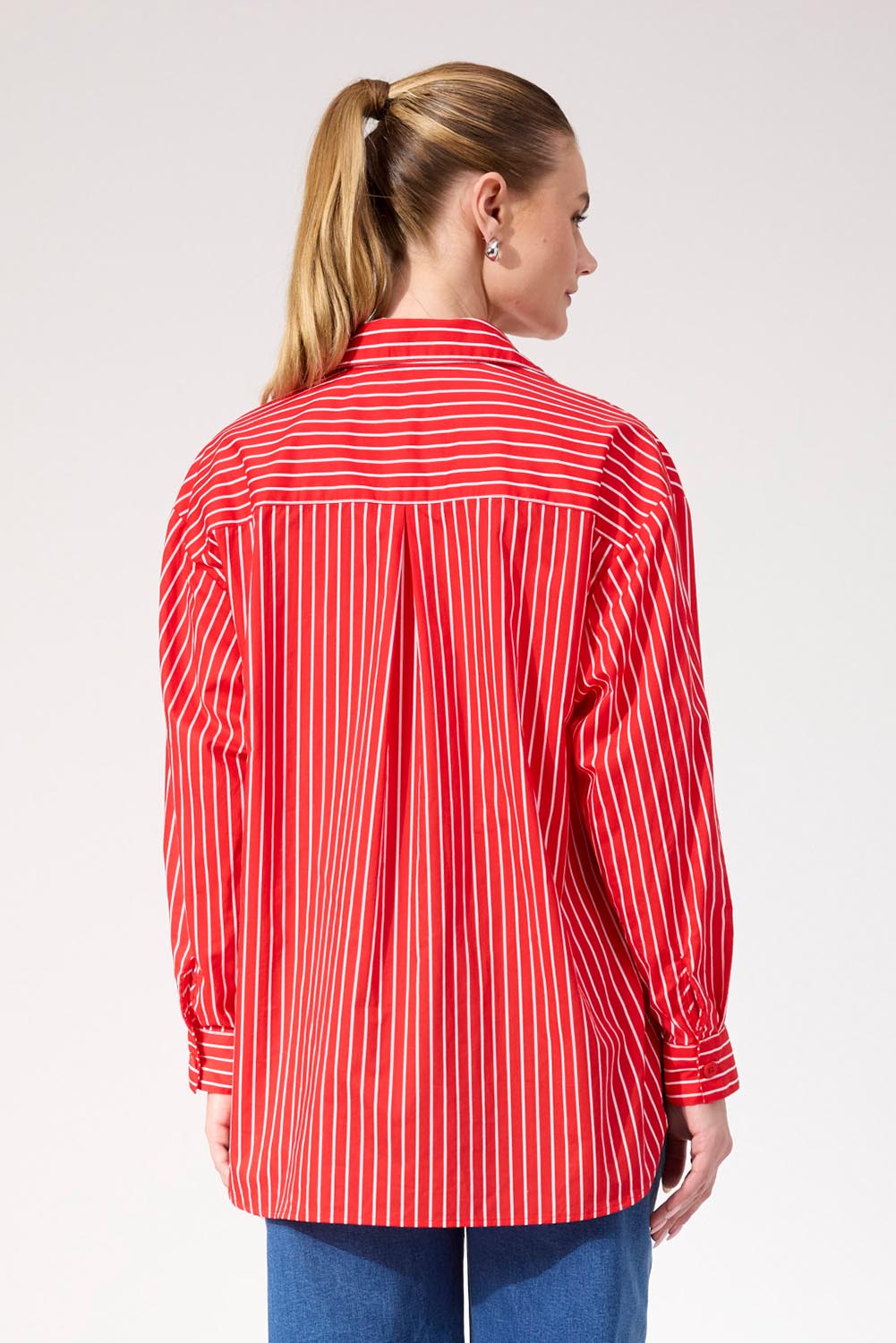 A model wearing the Fairbanks Stripe Shirt in colour Red (Red), from the back