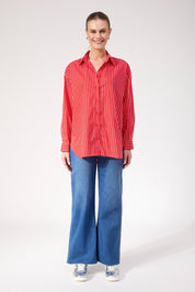 A model wearing the Fairbanks Stripe Shirt in colour Red (Red), from the front, showing the whole outfit
