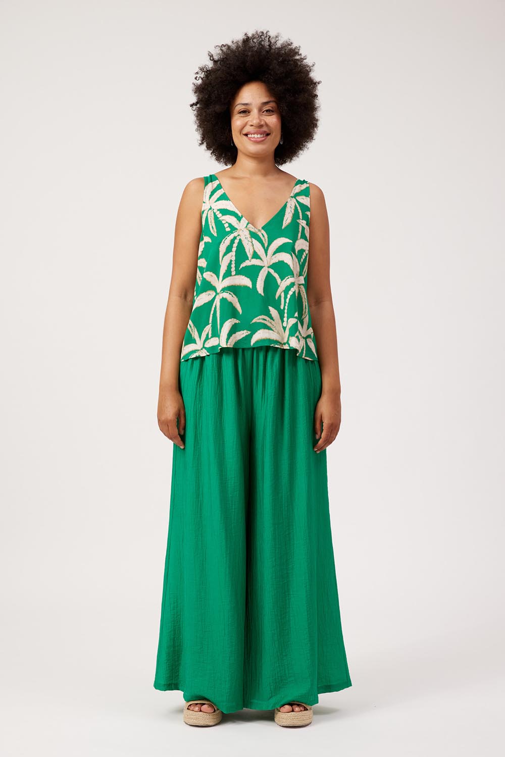Model Genericm wearing size sample of the Congo Tank – Palm in colour Palm, from the front