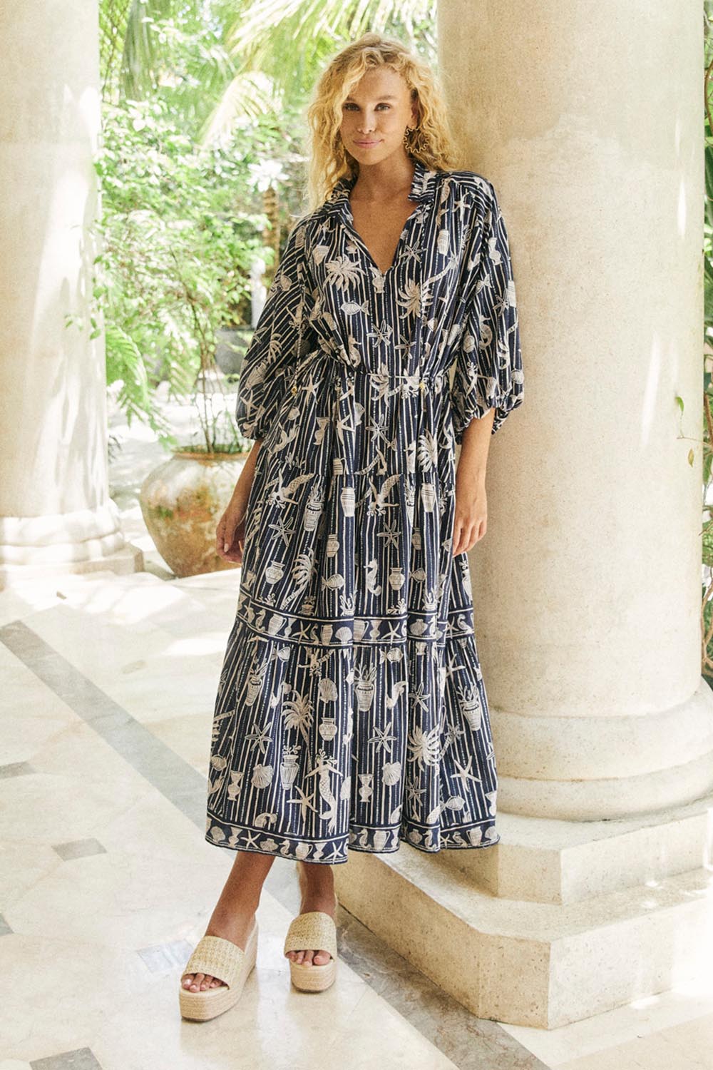 Model Genericm wearing size sample of the Crete Tiered Maxi Dress – Sea in colour Sea, from the front