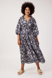Model Genericm wearing size sample of the Crete Tiered Maxi Dress – Sea in colour Sea, from the front