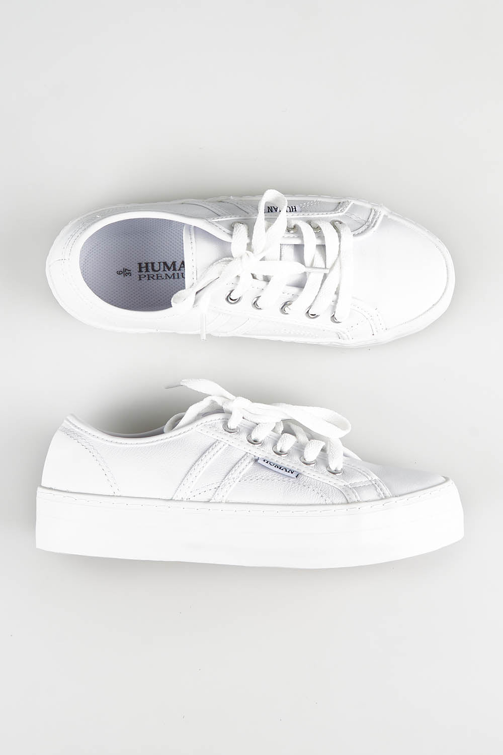 A model wearing size 37 of the Cass Sneaker in colour White (White), from the front, showing the whole outfit
