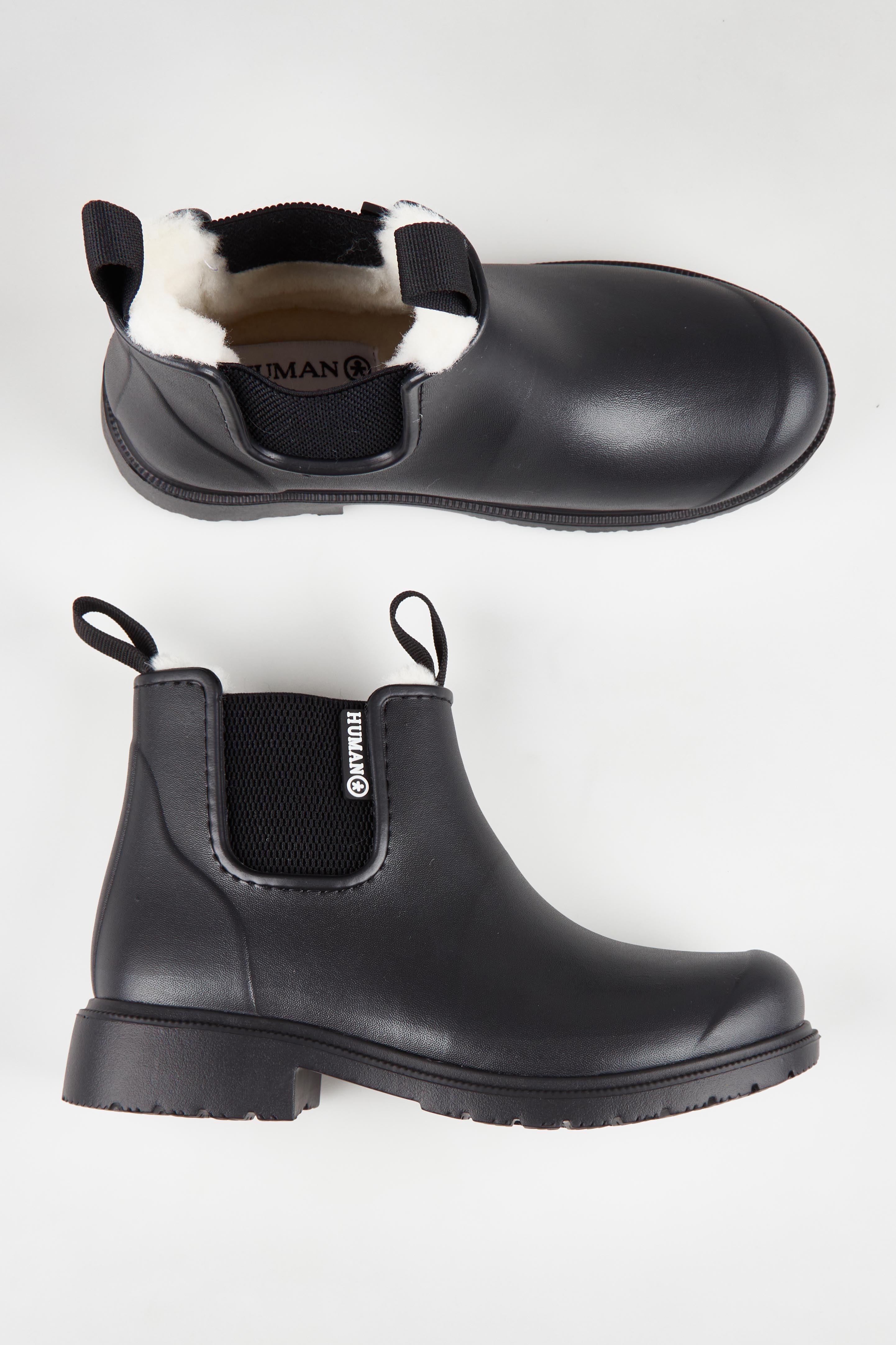 A model wearing size 37 of the Cooma Fur Lined Gumboot in colour Black (Black), from the front, showing the whole outfit