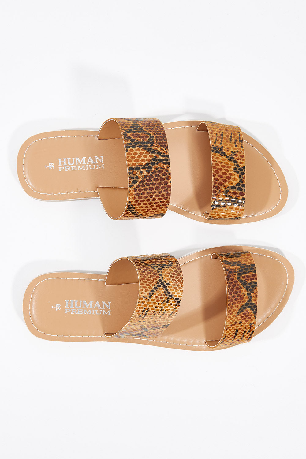 A model wearing size 38 of the Dakota Leather Sandal in colour Python, from the front, showing the whole outfit
