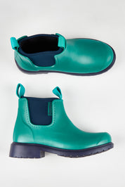 A model wearing size 37 of the Jam Neoprene Waterproof Boot in colour Seamist (Green), from the front, showing the whole outfit