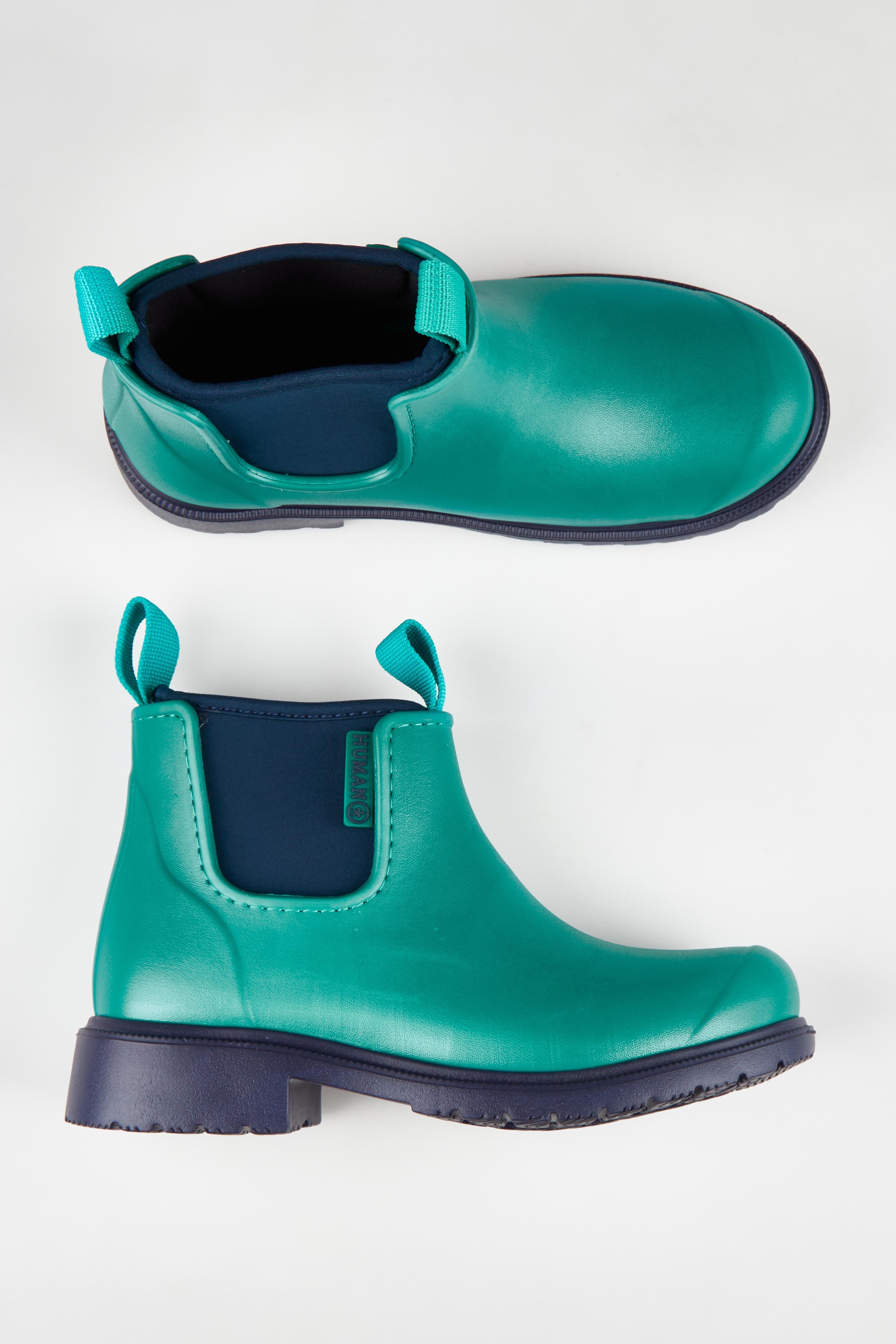 A model wearing size 37 of the Jam Neoprene Waterproof Boot in colour Seamist (Green), from the front, showing the whole outfit