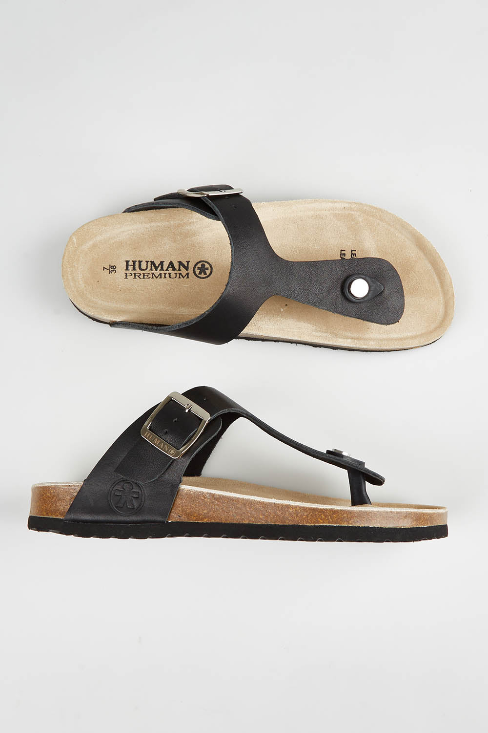 A model wearing size 37 of the Life Leather Slide in colour Black (Black), from the front, showing the whole outfit
