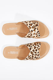A model wearing size 38 of the Quinn Leather Sandal in colour Ocelot, from the front, showing the whole outfit