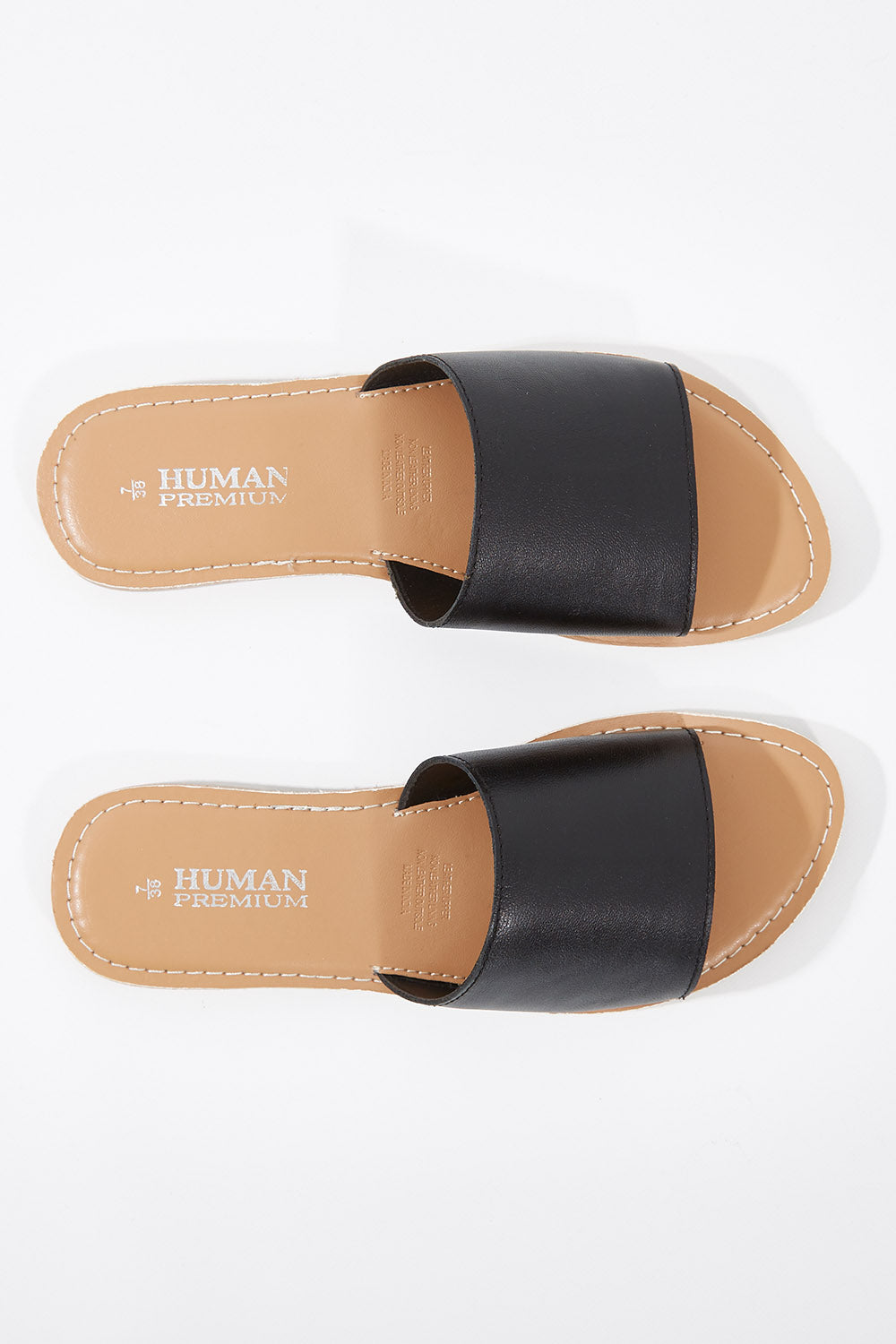 A model wearing size 38 of the River Leather Sandal in colour Black (Black), from the front, showing the whole outfit