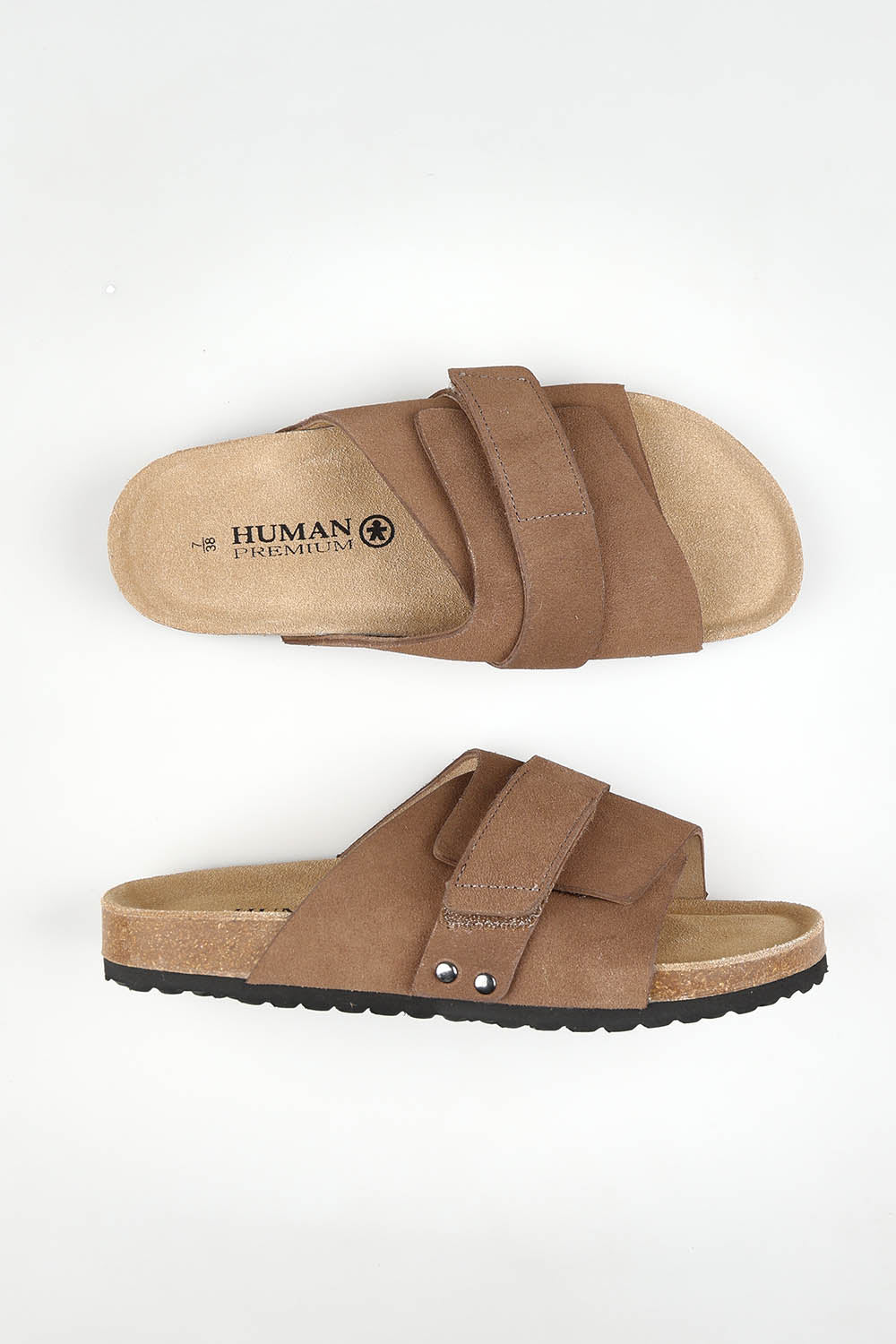 A model wearing size 37 of the Taylor Suede Slide in colour Tobacco, from the front, showing the whole outfit