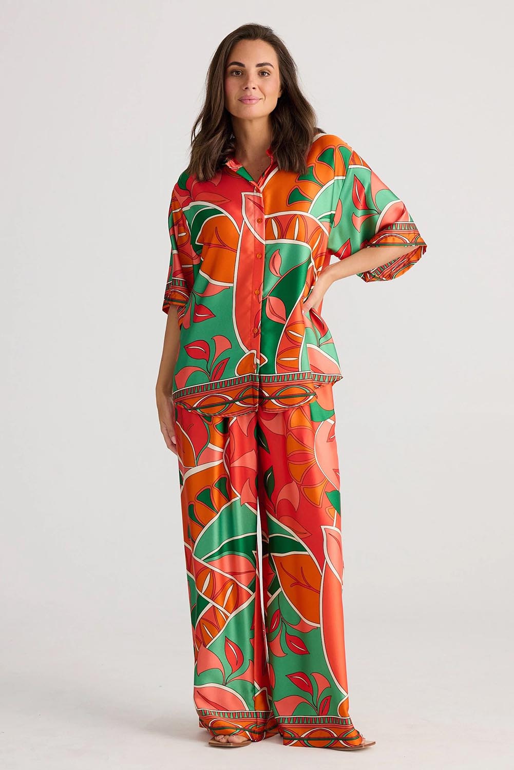 A model wearing the Playa Pant in colour Rainforest, from the front, showing the whole outfit
