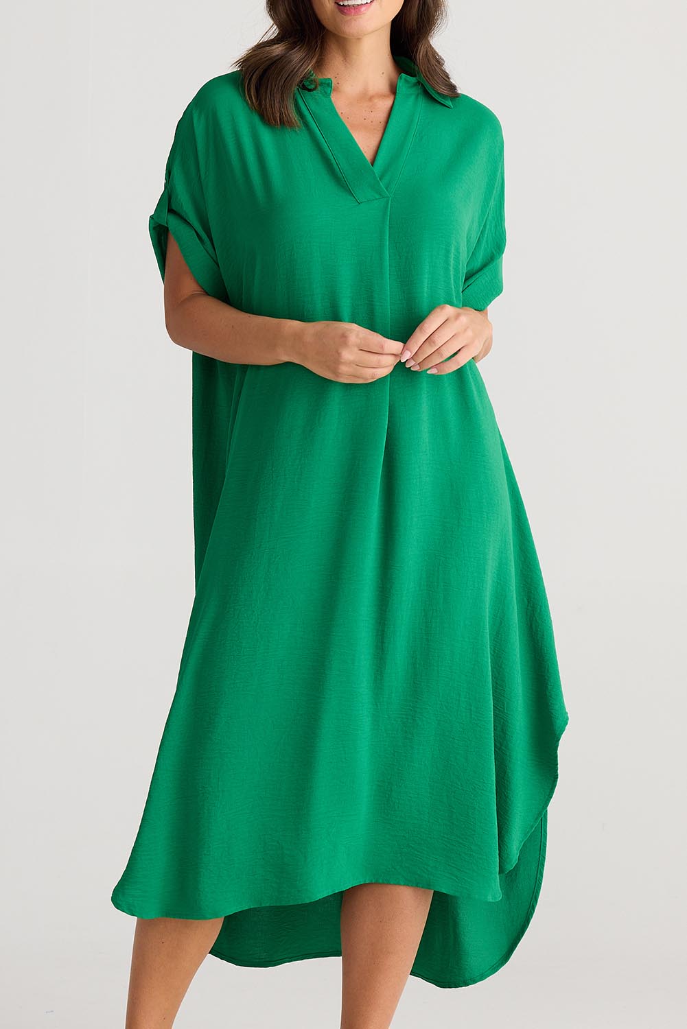 A model wearing the Canal Overshirt in colour Jade (Green), from the front, cropped image