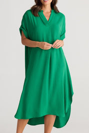 A model wearing the Canal Overshirt in colour Jade (Green), from the front, cropped image