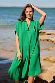 A model wearing the Canal Overshirt in colour Jade (Green), from the front, showing the whole outfit